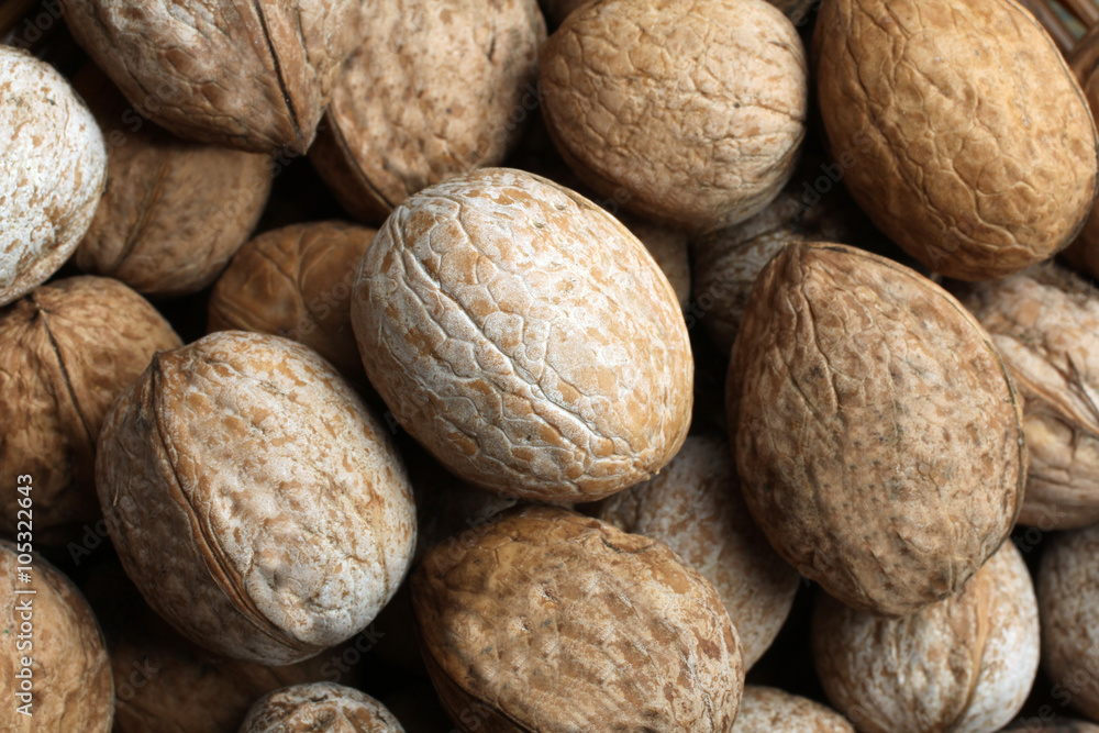 very tasty and a healthy heap of walnuts close up of the inscription very tasty and a healthy heap of walnuts close up of the inscription