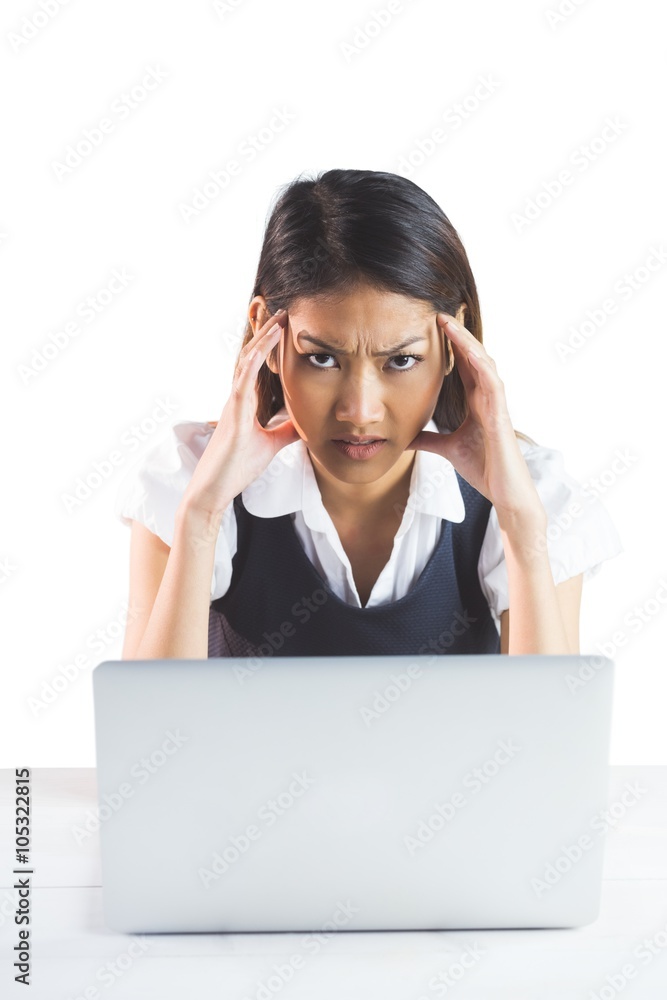 Nervous businesswoman using a laptop Nervous businesswoman using a laptop