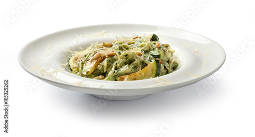 Pasta with spinach and zucchini. Front view.