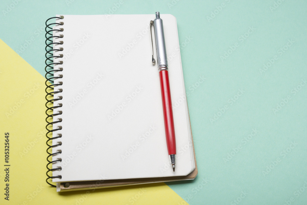 Office desk table with supplies top view. Notepad, pen and colorful paper. Copy space for text Office desk table with supplies top view. Notepad, pen and colorful paper. Copy space for text