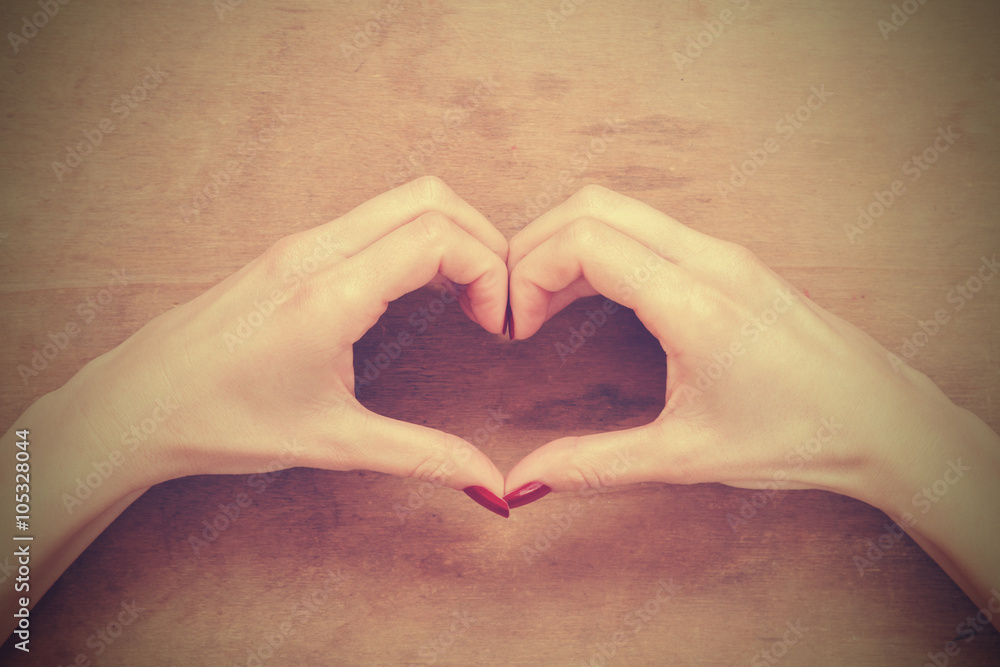 Girl making a heart - shape symbol. Girl making a heart - shape symbol.