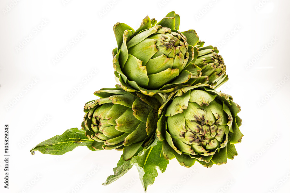 Three fresh artichokes, isolated on white background. Three fresh artichokes, isolated on white background.