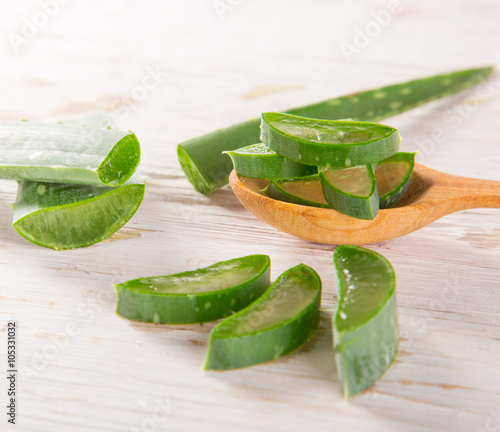 Aloe Vera leaves on wooden ...