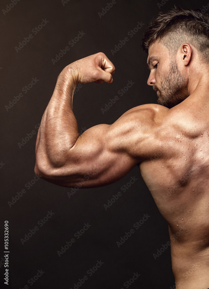 Strong Athletic Man Fitness Model posing back muscles, triceps, Strong Athletic Man Fitness Model posing back muscles, triceps,