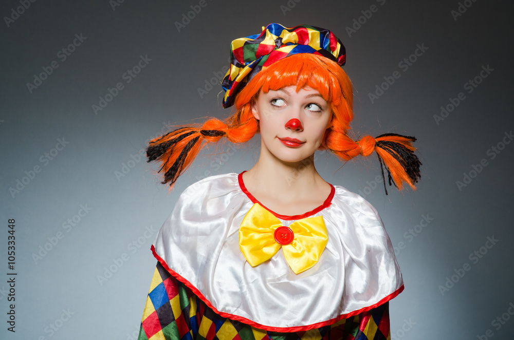 Clown in funny concept on dark background Clown in funny concept on dark background