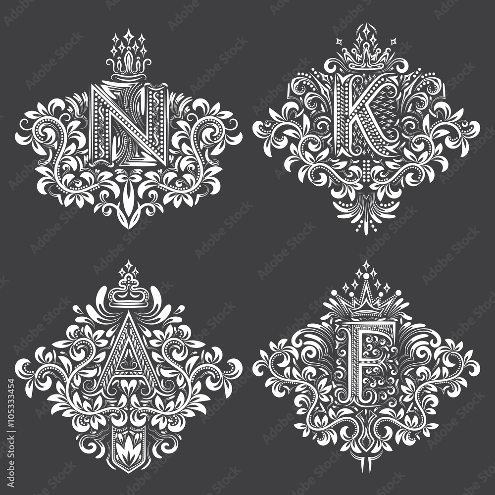Set of ornamental monogram in coats of arms form. White floral decorations on black. Isolated tattoos in vintage baroque style.