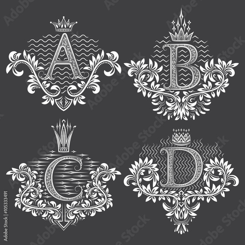 Set of ornamental monogram in coats of arms form. White floral decorations on black. Isolated tattoos in vintage baroque style.
