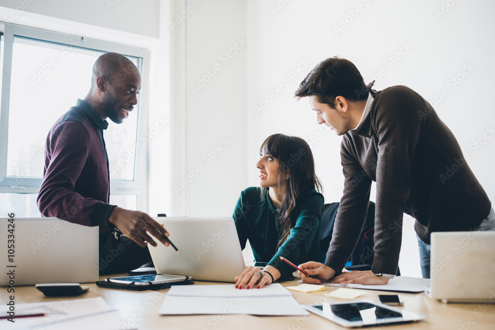 Multiracial business people working connected with technological Multiracial business people working connected with technological