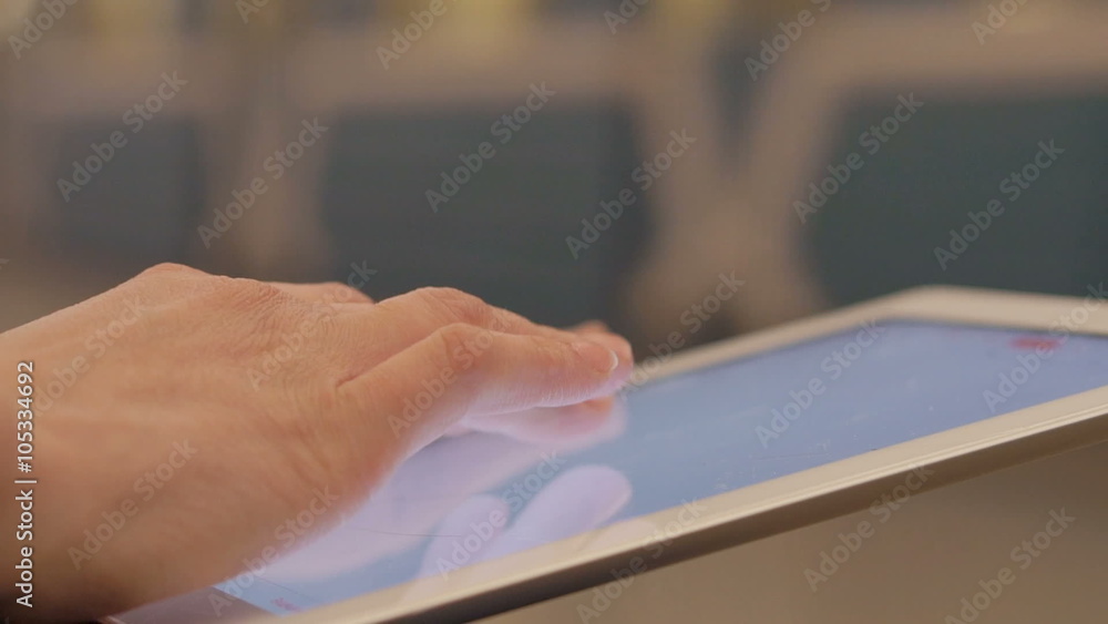 Woman Using Touchpad in the metro station Woman Using Touchpad in the metro station