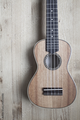 ukulele on wooden background. close up