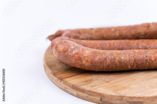 Raw sausages isolated on white