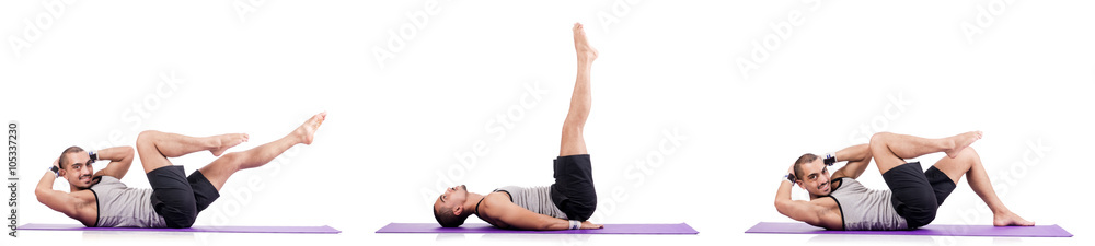 Obraz premium Man doing exercises on white
