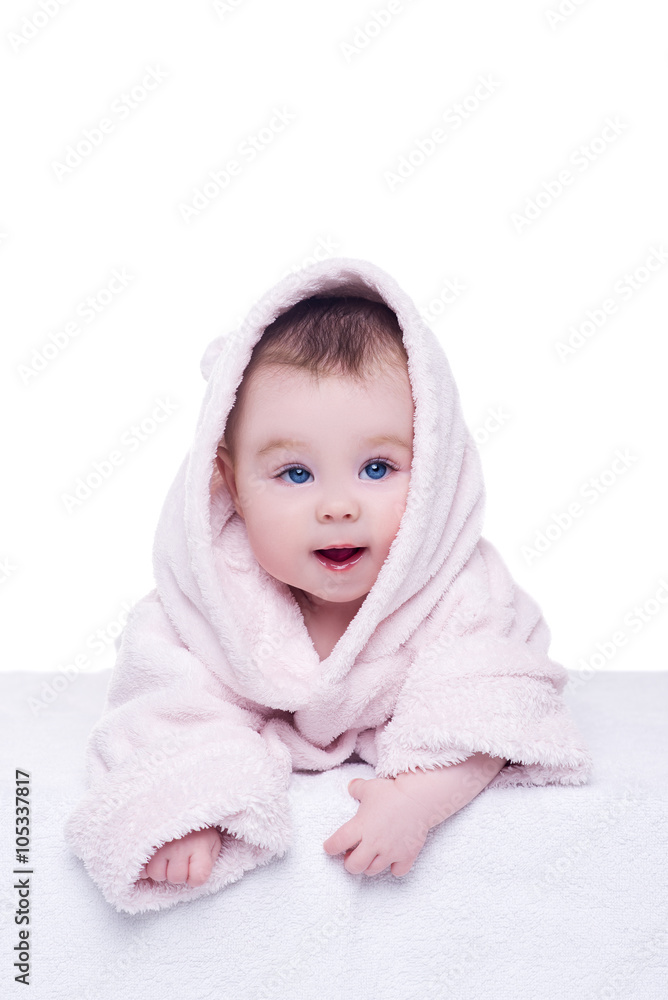 cute baby child in pink bathrobe lying down on blanket cute baby child in pink bathrobe lying down on blanket