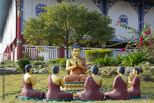 Buddha Statues at the Lotus Stupa - Lumbini, Nepal photo