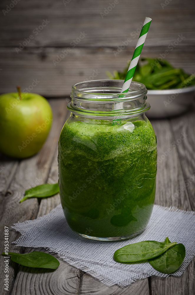 Healthy green smoothie with apple and spinach. Rustic background. Selective focus. Copy space. Healthy green smoothie with apple and spinach. Rustic background. Selective focus. Copy space.