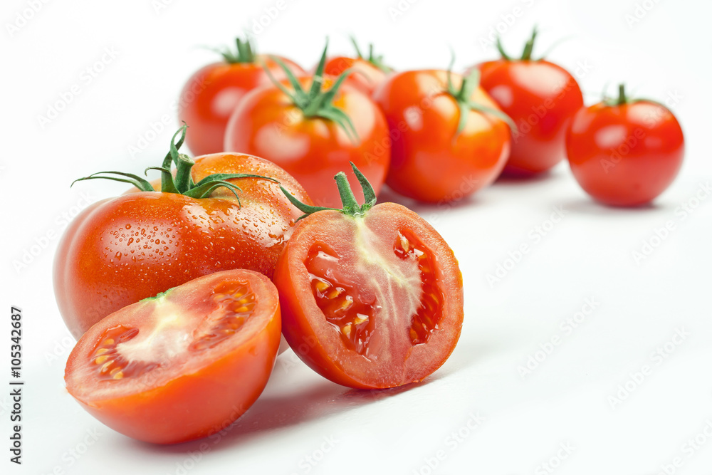 Tomatoes. Whole and a half isolated on white Tomatoes. Whole and a half isolated on white