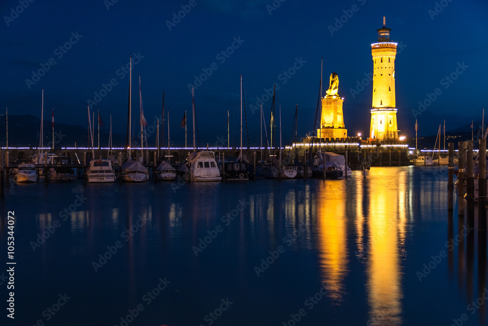 Fototapeta premium LINDAU, GERMANY - Lighthouse at port of Lindau harbour, Lake Constance, Bavaria