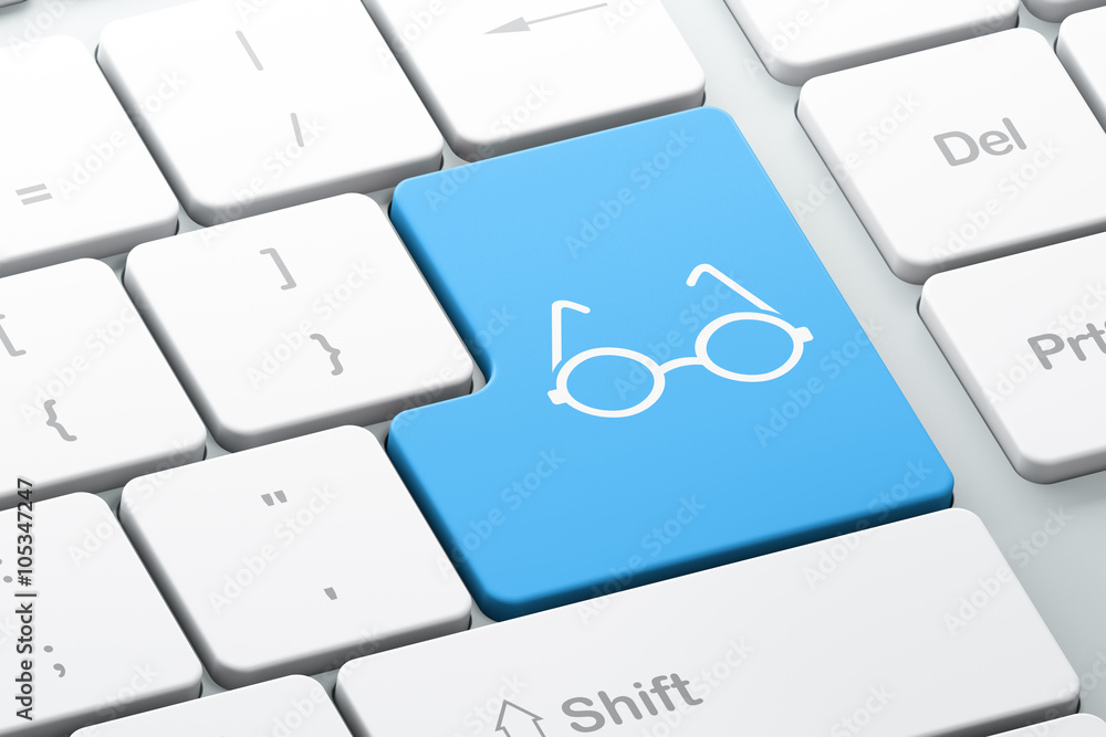 Learning concept: Glasses on computer keyboard background Learning concept: Glasses on computer keyboard background