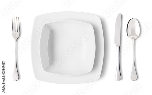 Fototapeta Naklejka Na Ścianę i Meble -  Place setting with plates, fork, knife and spoon - Posto a tavola con piatti, forchetta, coltello e cucchiaio