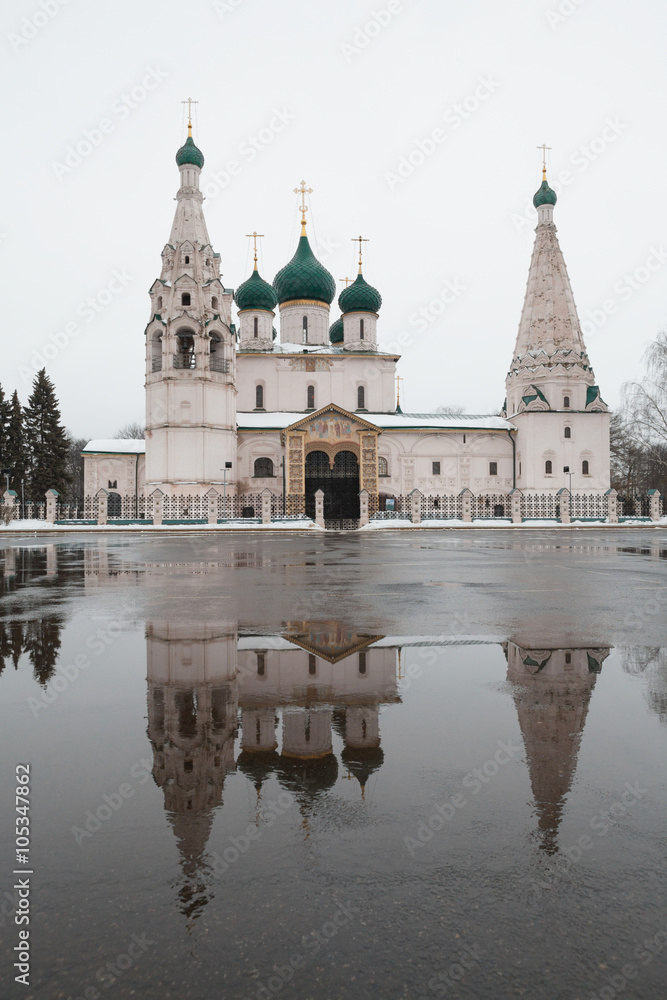 The Elias Church with its reflection in the puddle at rainy weather. Golden Ring of Russia.
