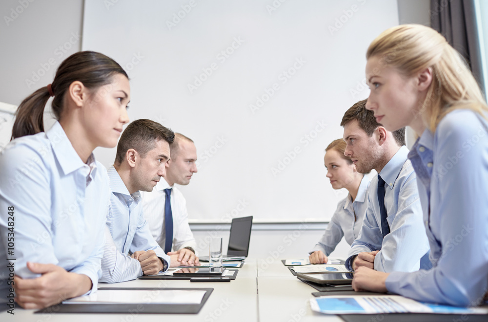 smiling business people having conflict in office