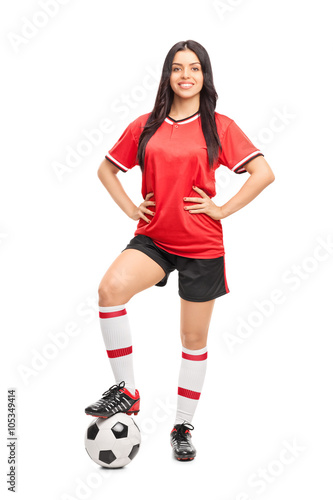 Female football player in a red jersey