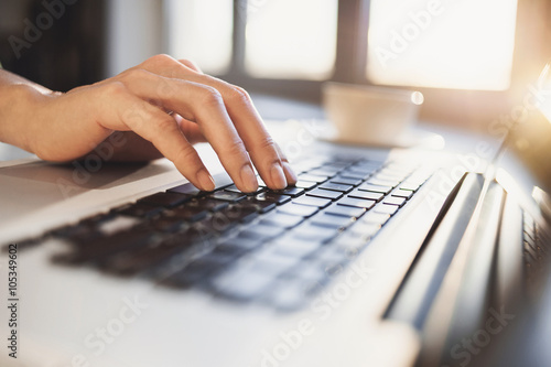Hand on a computer keyboard
