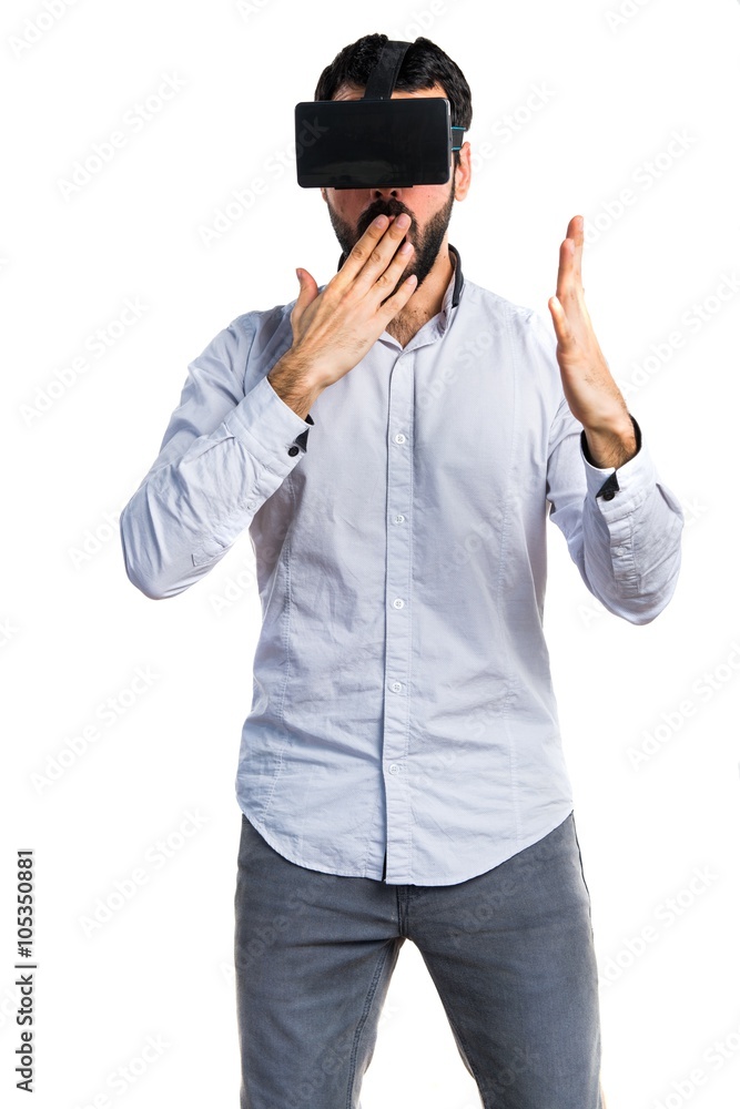 Man using VR glasses doing surprise gesture Man using VR glasses doing surprise gesture
