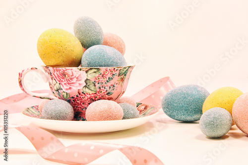 Decorative easter eggs in china cup