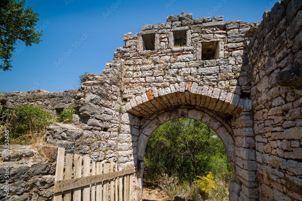 Main gate to old ruined fortress in Sutomore, Montenegro