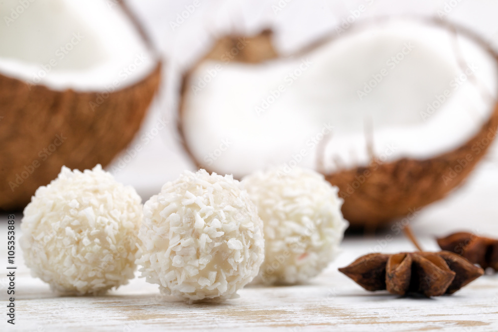 Candies and fresh coconut on white background Candies and fresh coconut on white background