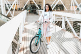 Beautiful young girl with bicycle 