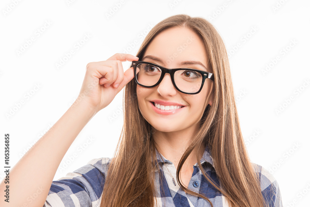 Close up portrait of smiling smart woman touching her glasses
