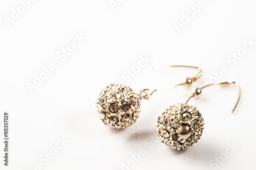  Fashionable earrings with silver and crystal glass isolated on white background
