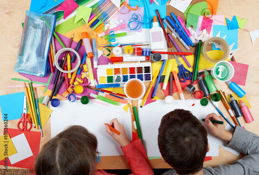 Obraz premium Child drawing top view. Artwork workplace with creative accessories. Flat lay art tools for painting.