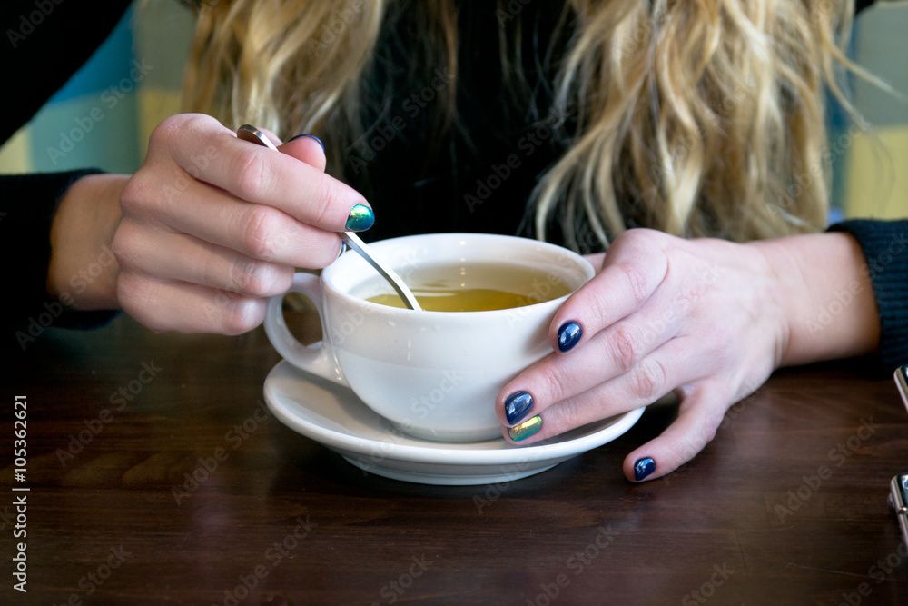Woman drink tea in a cafe Woman drink tea in a cafe