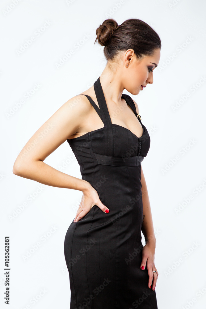 Side view of young pretty woman posing on white background Side view of young pretty woman posing on white background