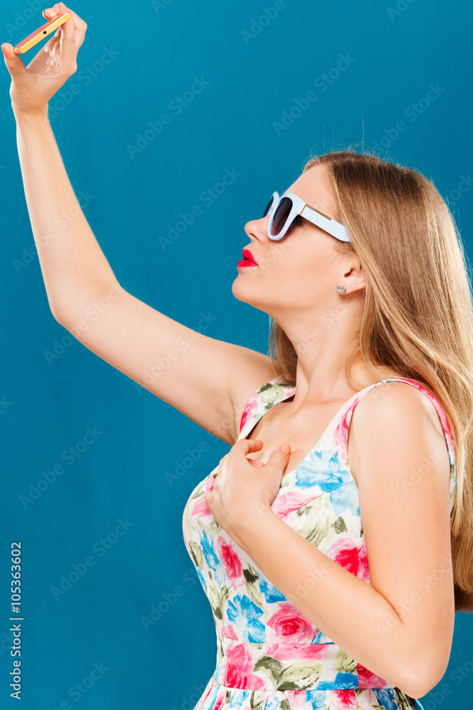 Young pretty girl, taking selfie on her smart phone Young pretty girl, taking selfie on her smart phone