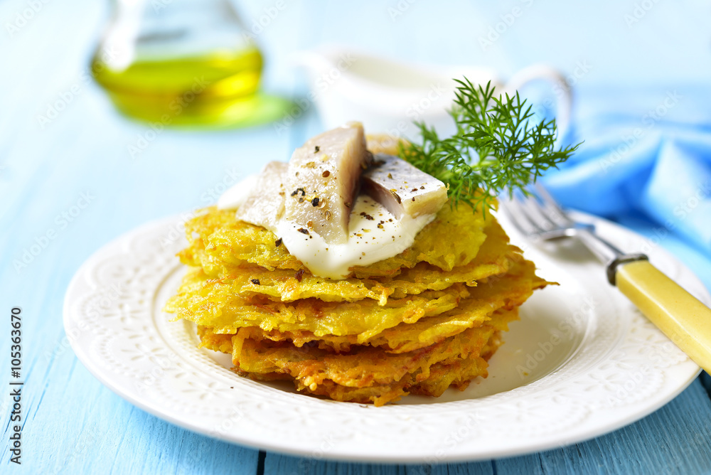 Potato fritters with herring. Potato fritters with herring.