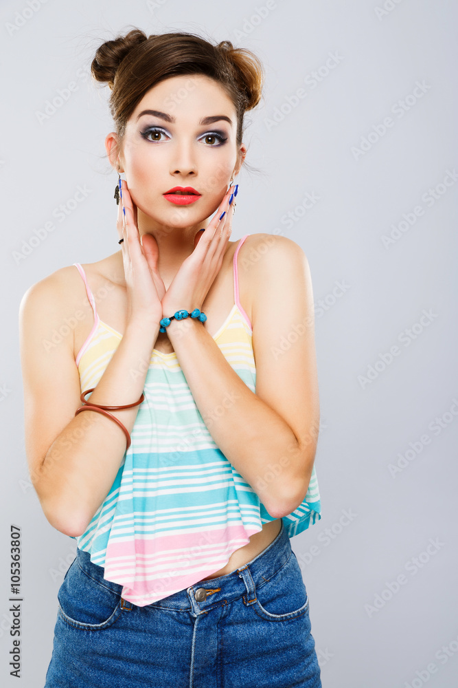 Beautiful girl wearing shirt at gray studio background Beautiful girl wearing shirt at gray studio background