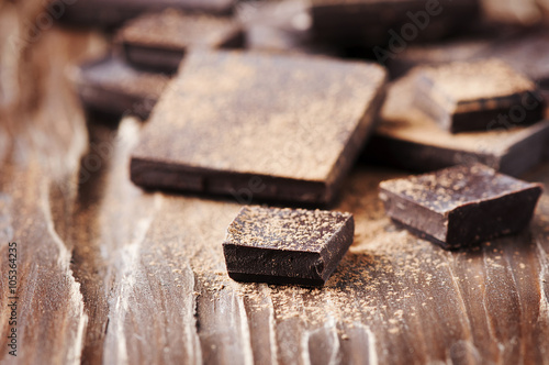 Dark chocolate on the wooden table