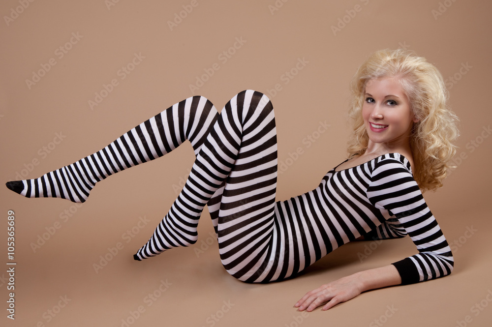 Cute Smiling Teen in Striped Bodysuit Stock Photo