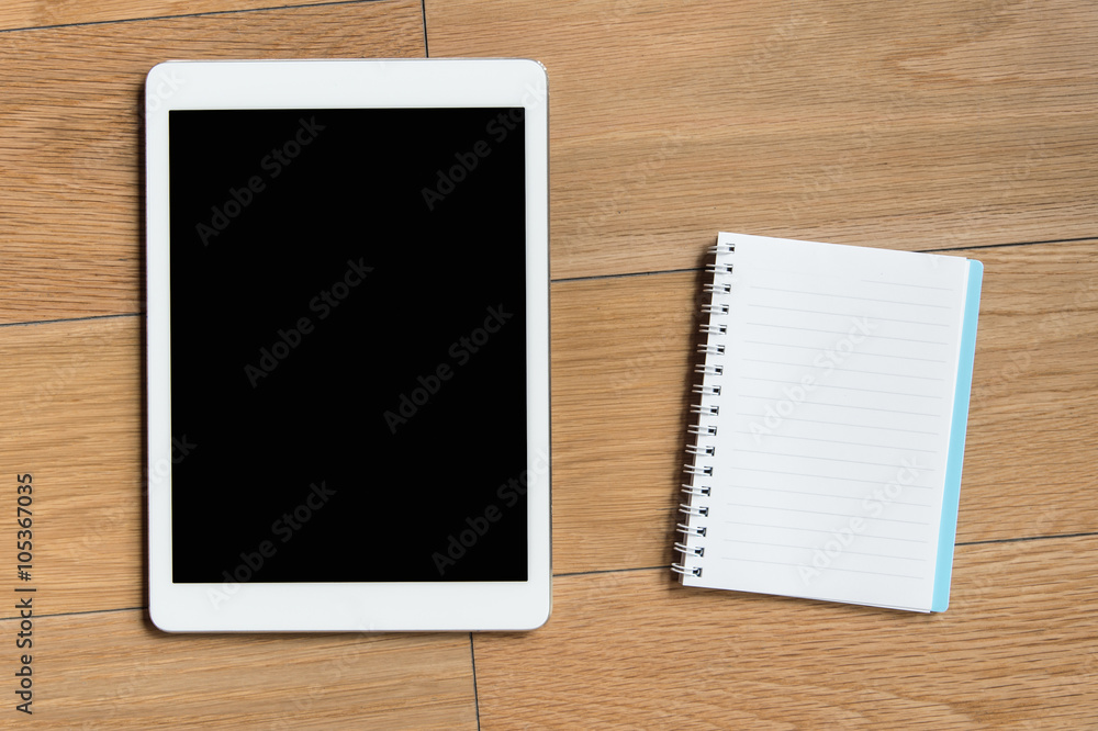 tablet on wood desk on top view tablet on wood desk on top view