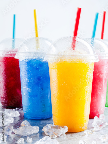 Colorful Frozen Fruit Slush Drinks in Plastic Cups