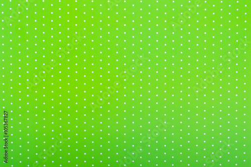 Bright green background with dots