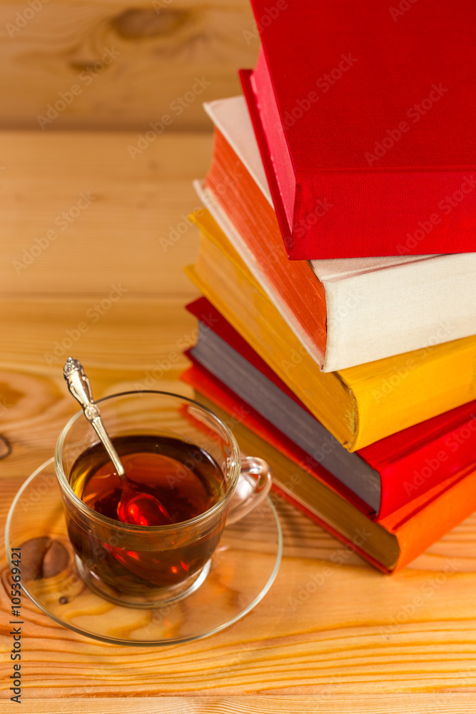 Cup of tea and books onwooden background Cup of tea and books onwooden background