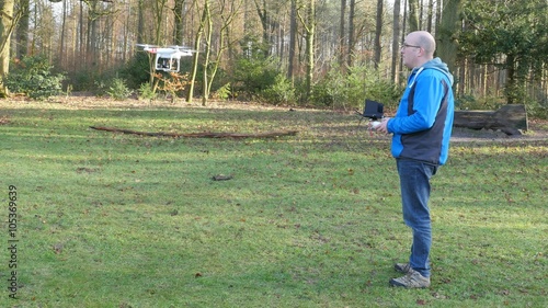 A man is operating a drone, 4K UltraHD, 4K UltraHD photo