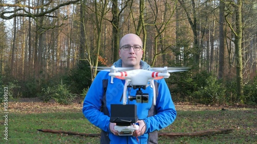 A man is operating a drone, 4K UltraHD, 4K UltraHD photo