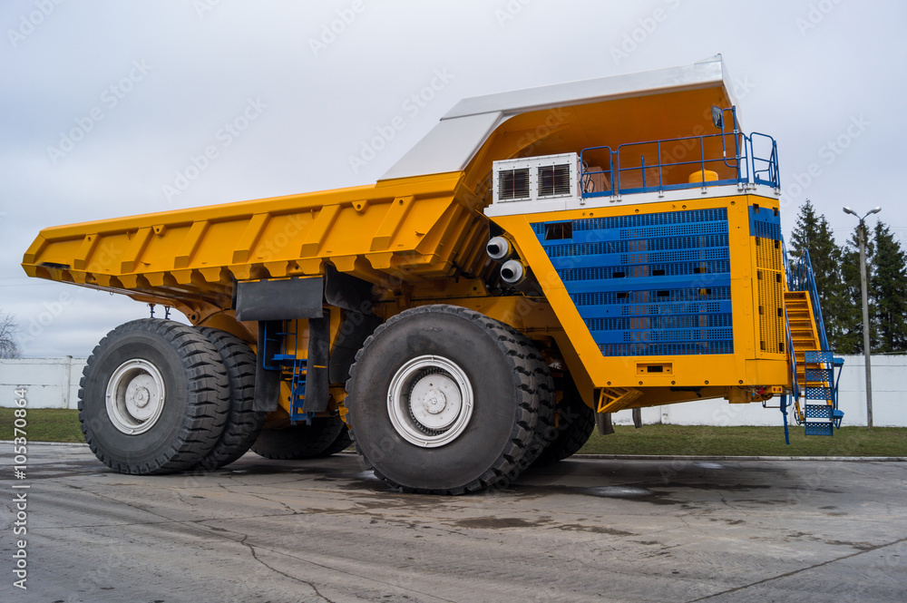 Yellow coloring huge mining haul truck background copy space