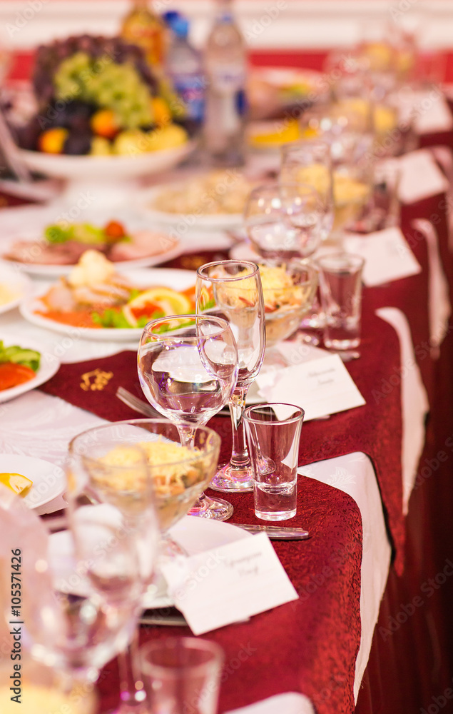 Fototapeta premium catering table set service with silverware, napkin and glass at restaurant before party